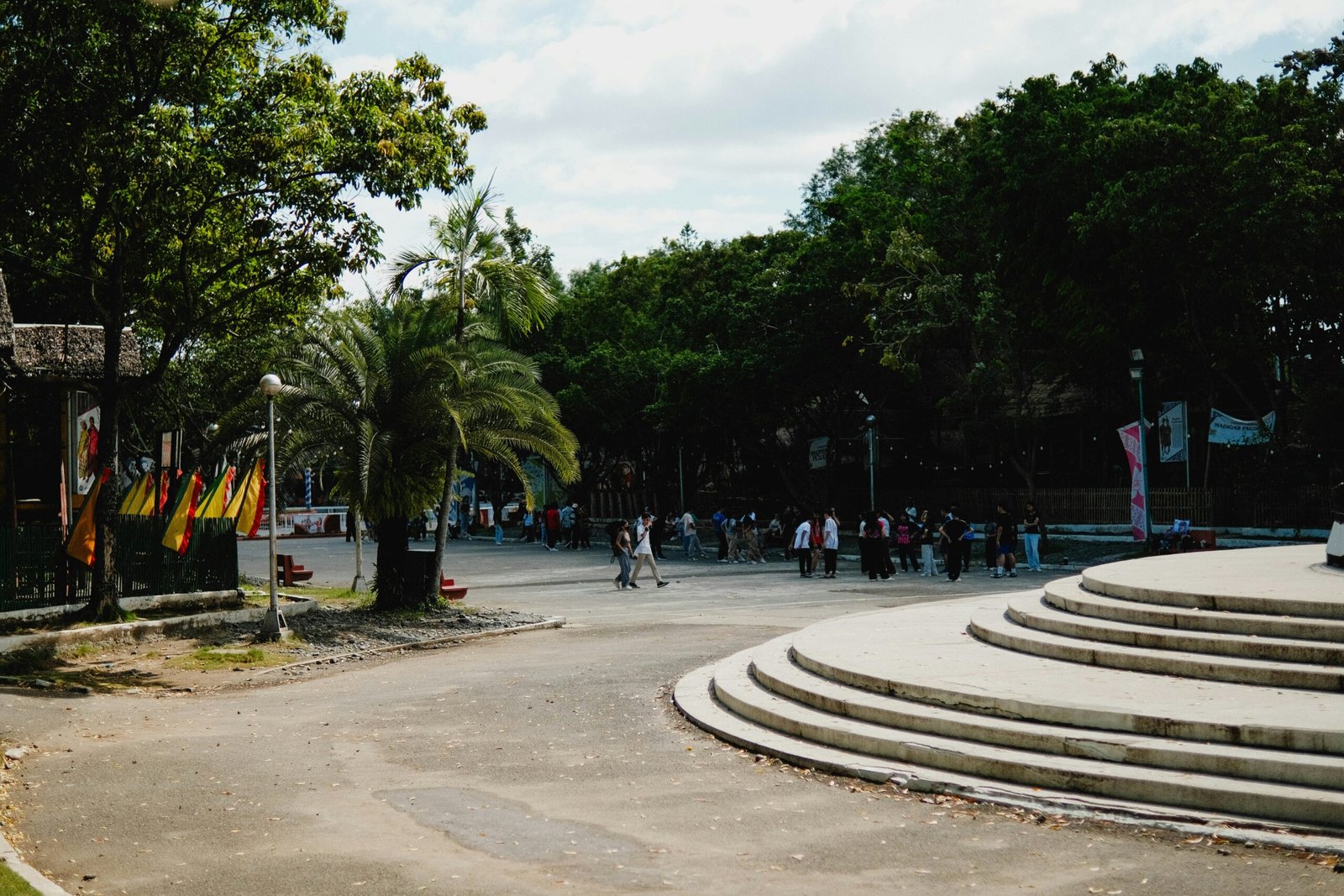 a group of people walking around a park